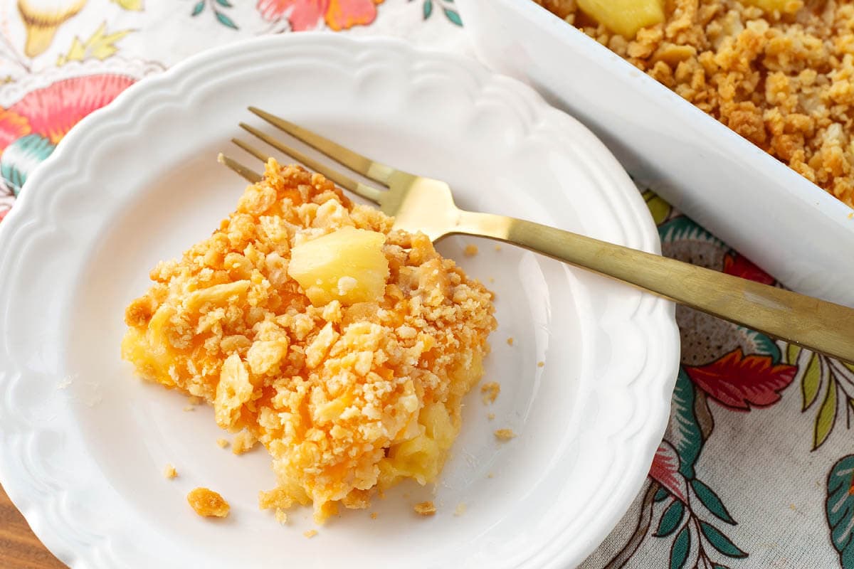 Southern Pineapple Casserole portion on a white plate.